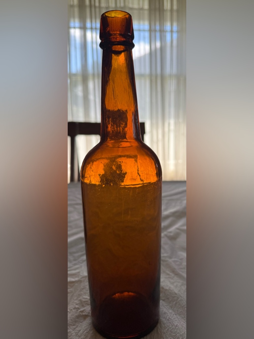 Light Amber color Vintage Glass Tall Bottle